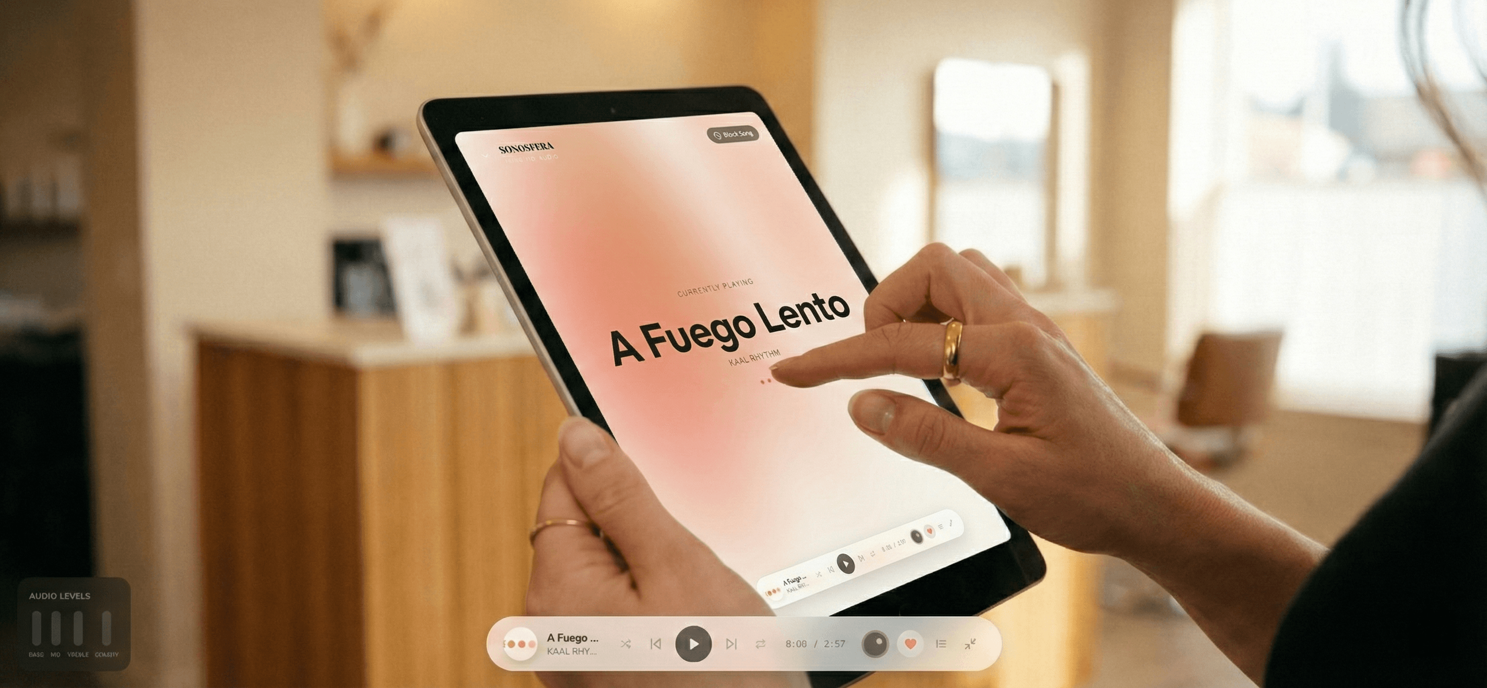 Cafe operator selecting a Sonosfera track on a tablet in a warm venue
